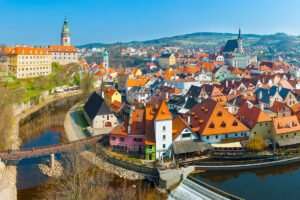 View of Cesky Krumlov Castle and red-roofed town by river
