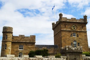 Culzean Castle stone towers, clock tower, Scottish flag