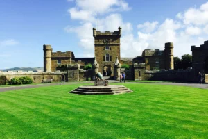 Culzean Castle entrance, manicured lawn and blue sky