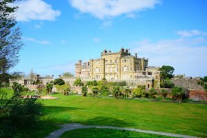 Culzean Castle overlooking gardens and sea under blue sky