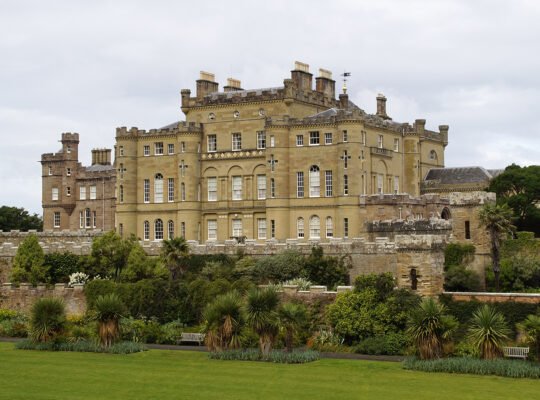 Culzean Castle exterior with gardens and coastal walls under overcast sky