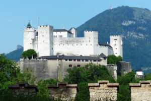 Fortress Hohensalzburg perched on Festungsberg with mountains behind