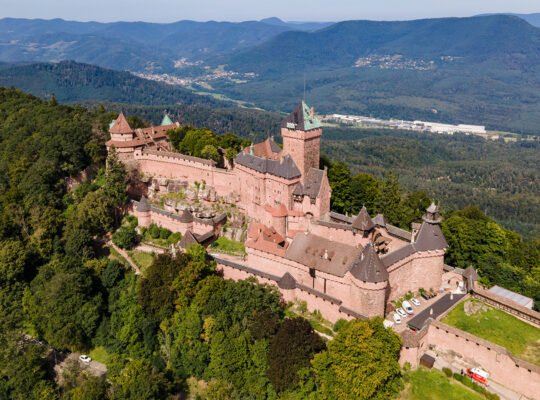 Aerial view of Haut-Koenigsbourg Castle on forested Vosges hill