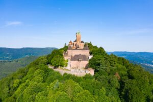 Aerial view of Haut-Koenigsbourg Castle on a forested hilltop