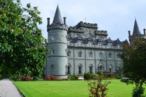 Inveraray Castle beside green lawn and turrets