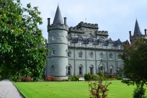 Inveraray Castle beside green lawn and turrets