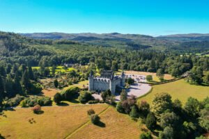 Aerial view of Inveraray Castle among Scottish hills