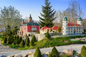 Miniature Ksiaz Castle model among trees and paths