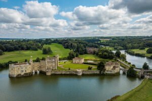 Aerial view of Leeds Castle surrounded by moat and green estate
