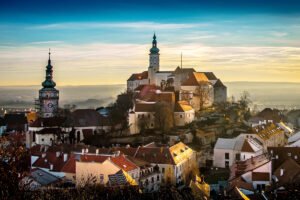 Mikulov Castle on hill overlooking town at golden sunset