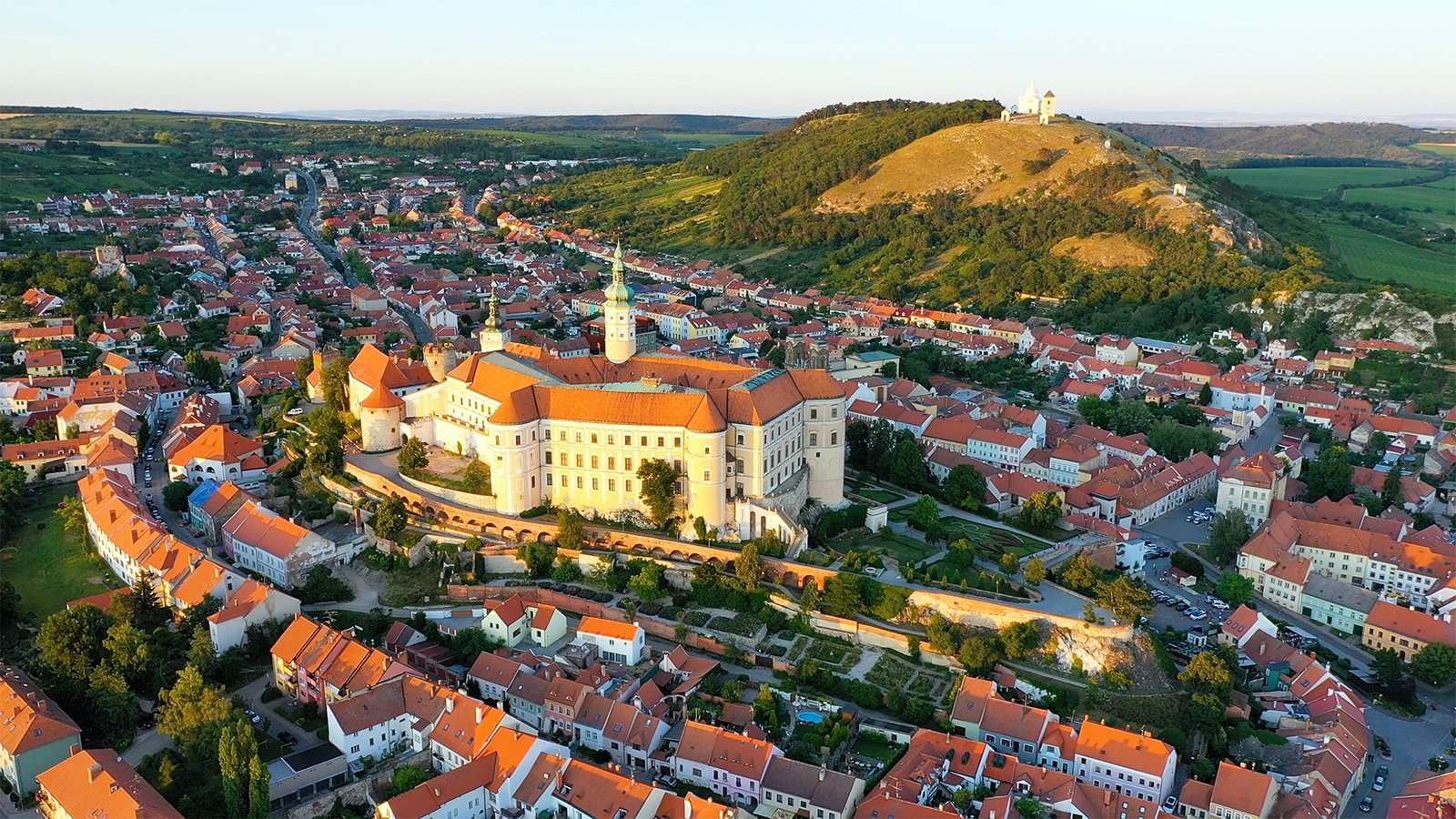 Aerial view of Mikulov Castle and historic town at golden hour