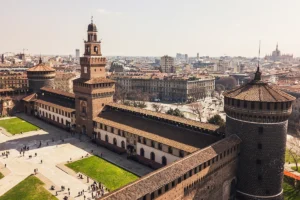 Aerial view of Sforzesco Castle courtyard and Milan skyline