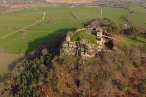Aerial view of Beeston Castle perched on rocky crag