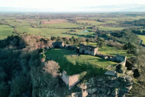 Aerial view of Beeston Castle atop rocky crag
