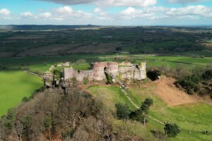 Aerial view of Beeston Castle atop rocky hill
