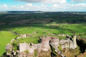 Aerial view of Beeston Castle ruins and surrounding Cheshire green fields