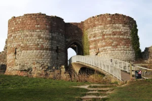 Beeston Castle twin round towers and bridge entrance, weathered stone