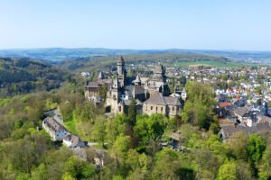Aerial view of Braunfels Castle on wooded hilltop