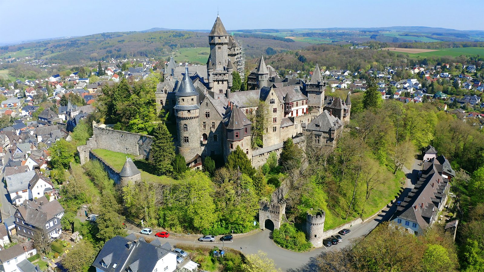 Aerial view of Braunfels Castle on wooded hill above town