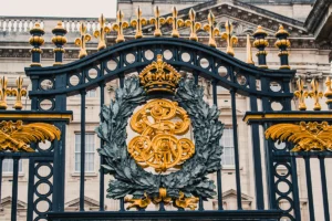 Ornate golden gates at Buckingham Palace entrance