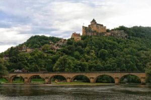 Château de Castelnaud above bridge and river
