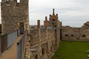 View along the battlements and inner courtyard of Framlingham Castle on an overcast day