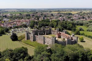 Aerial view of Framlingham Castle within green Suffolk countryside