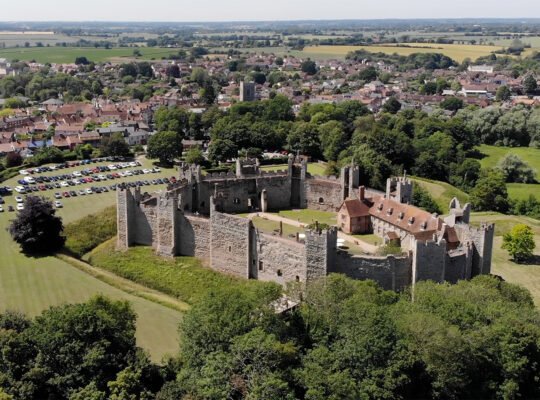 Aerial view of Framlingham Castle with town and green fields