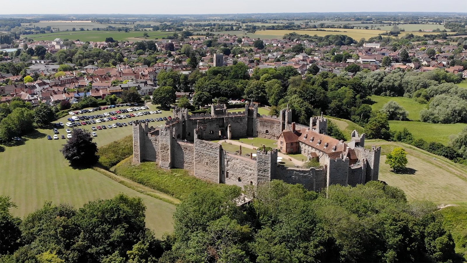 Aerial view of Framlingham Castle with town and green fields