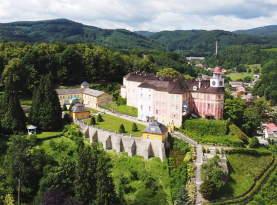 Aerial view of Jansky Vrch Castle on green hill