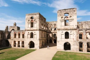 Krzyztopor Castle interior ruins courtyard under blue sky