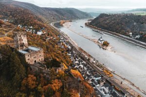 Aerial view of Pfalzgrafenstein Castle on a Rhine island, autumn colors