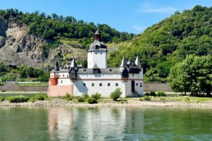Pfalzgrafenstein Castle on a Rhine river islet, white tower and reflections