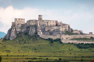 Spiš Castle on limestone hill with fortified walls and tower