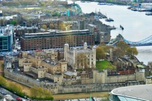 Aerial view of The Tower of London beside the River Thames