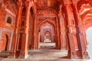 Interior arches and pillars of Agra Fort in red sandstone
