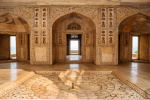 Interior marble inlay chamber at Agra Fort with carved arches and central fountain