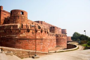 Agra Fort exterior walls and round bastions under clear sky