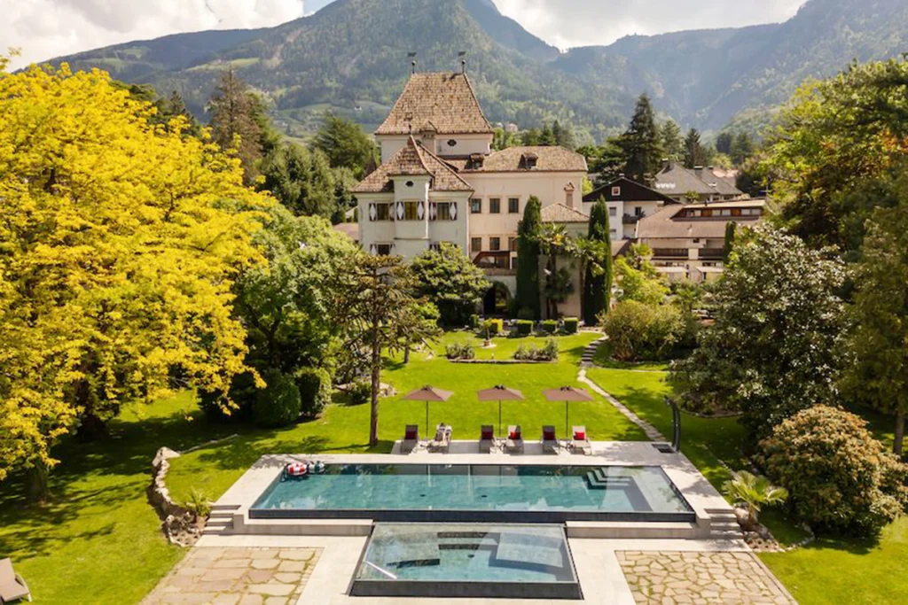 Castel Rundegg with pool, garden, mountain backdrop