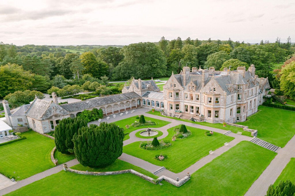 Aerial view of Castle Leslie Estate with manicured gardens and fountain