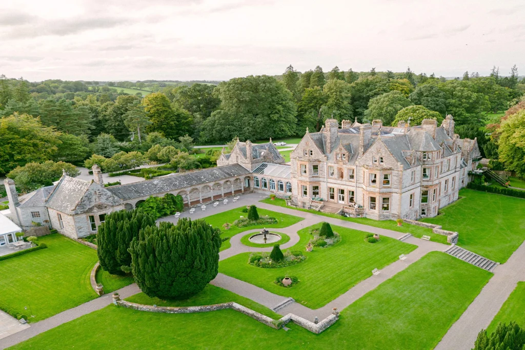 Aerial view of Castle Leslie Estate with manicured gardens and fountain