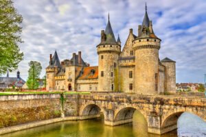 Château de Sully-sur-Loire across moat with stone bridge and round turrets