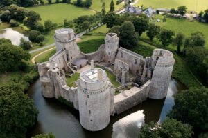 Aerial view of Hunaudaye Castle surrounded by moat and woodland