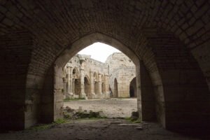 View through arch at Krak des Chevaliers courtyard