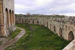 Krak des Chevaliers stone walls and arched moat view