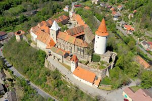 Aerial view of Krivoklat Castle perched on forested hill
