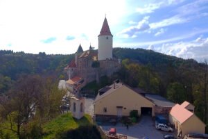 Krivoklat Castle perched above wooded valley