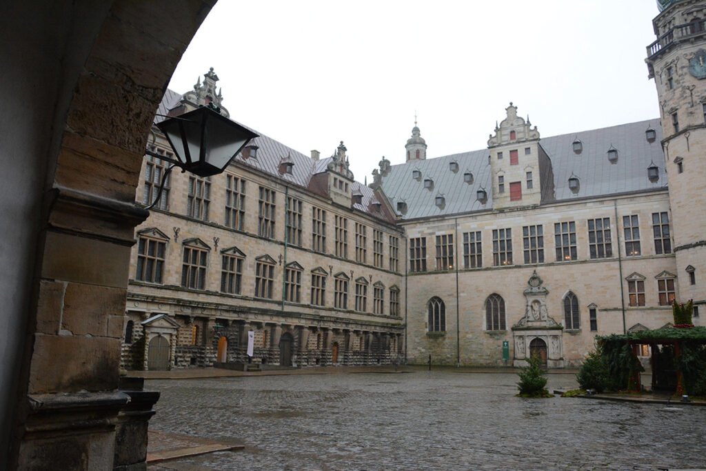 Kronborg Castle inner courtyard with wet cobbles and stone facades