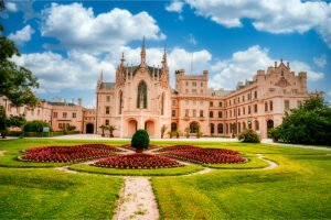 Pink neo-Gothic Lednice Castle facade with gardens