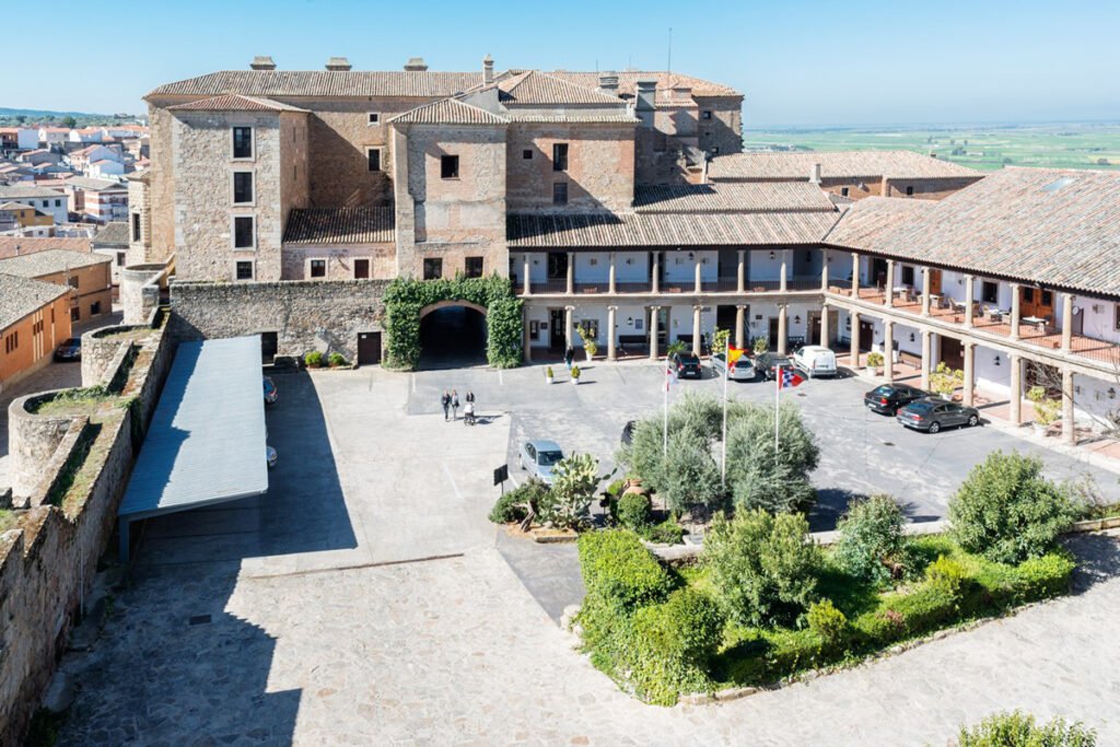 Aerial view of Parador de Oropesa courtyard and medieval castle-hotel